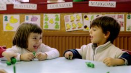 BASQUE SCHOOL CHILDREN PLAY UNDER BANNERS IN EUSKERA